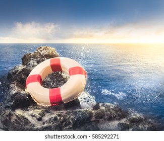 Life Preserver Ring On A Rocky Surface At Sea