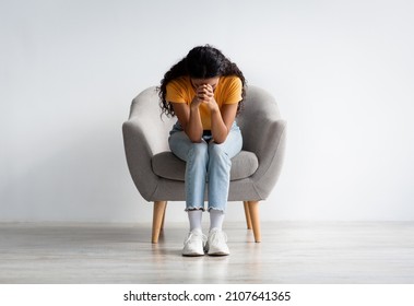 Life Problems Concept. Portrait Of Despaired Brunette Lady Sitting With Head Down In Armchair At Home, Upset Millennial Female Suffering Depression Or Having Nervous Breakdown, Copy Space - Shutterstock ID 2107641365