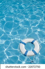 Life Ring Floating On Top Of Sunny Blue Water