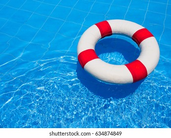 Life ring in swimming pool for summer concept with copy space. - Powered by Shutterstock