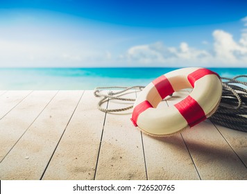 life saver on a dock at the beach on a sunny day