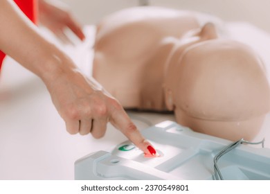Life saving CPR techniques in a comprehensive first aid course using a training dummy.
