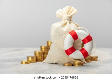 Lifebuoy And Bag Of Money. Help In Savings.