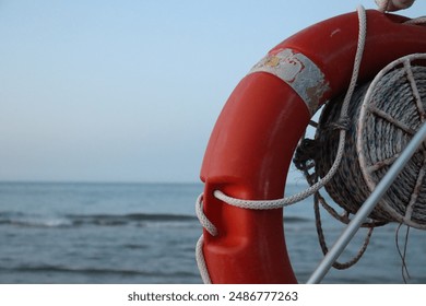 Lifebuoy Marine foam lifebuoy and sea - Powered by Shutterstock