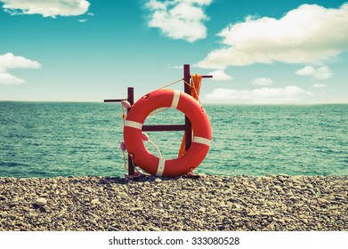 Lifebuoy on a sea background/beach season/vintage instagram effect/summer rest