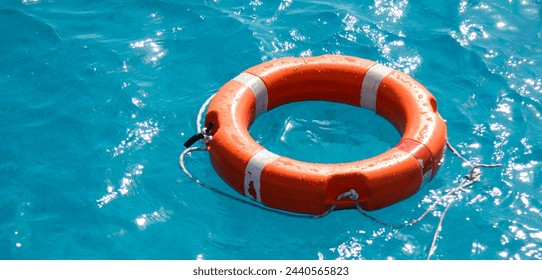 Lifebuoy on sea waves, space for text. Concept: seaside holidays, beach holidays, good price