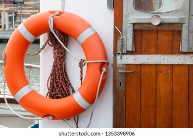 Lifebuoy On A Ship's Wall On A Boat With Entrance Door