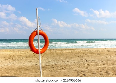 Lifebuoy On A Tropical Beach. Water Safety Concept.