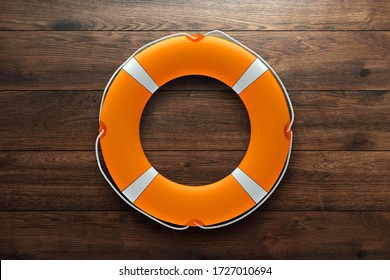 Lifebuoy on a wooden background. Help, rescue concept. Copy space.