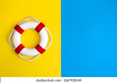 Lifebuoy on a yellow and blue background