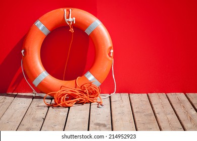 Lifebuoy stands on wooden floor of lifeguard station