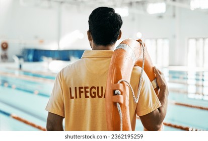 Lifeguard, back and person with swimming, pool or safety lifebuoy for rescue support, help or life saving. Surveillance attention, equipment and expert for protection, security or medical emergency