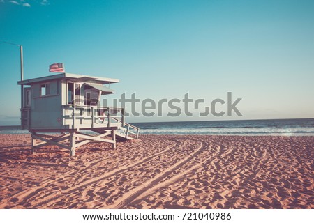 Lifeguard cabin on Santa Monica beach in California on sunset, retro toned