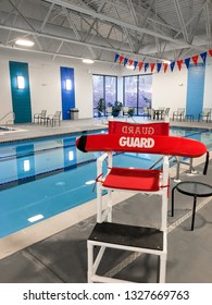 A Lifeguard Chair At An Indoor Pool