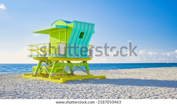 Lifeguard hut on the beach in Miami Florida,\
colorful hut on the beach during sunrise Miami South Beach. Sunny\
day on the beach