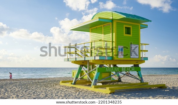 Lifeguard hut on the beach in\
Miami Florida, colorful hut on the beach during sunrise Miami South\
Beach.