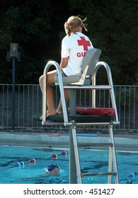 Lifeguard Keeping Watch At Pool