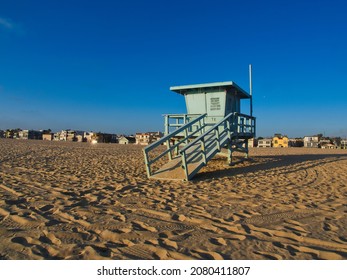 Lifeguard post at the beach near Los Angeles. California classic lifeguard station against a clear blue sky as a background. Empty lifeguard house on a sunny warm afternoon.