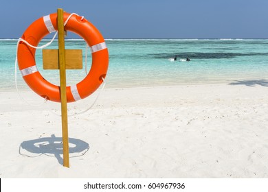 Lifeguard Safety Ring On White Sand Beach