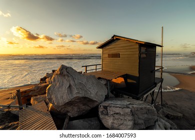 A lifeguard tower with dramatic sky
