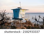 A lifeguard tower at sunset in El Matador Beach, Malibu, California