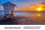 A lifeguard tower at sunset on Mission Beach in San Diego, California