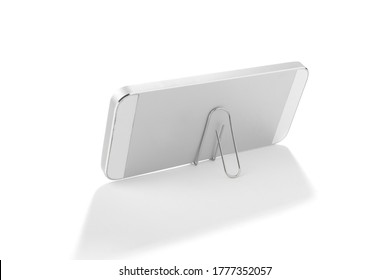 Lifehack; binder clip as a smart phone stand isolated on white background.    