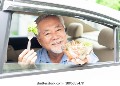 Lifestyle Asian Senior Man ,old Man Feel Happy Enjoy Eating Diet Food Fresh Salad On His Car 