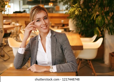lifestyle, business and people concept:  Successful  business woman sitting In Coffee Shop. Close up.
