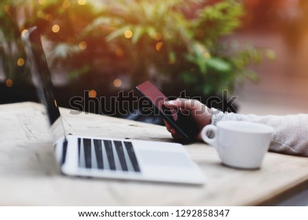Lifestyle education student. Businessman work on laptop for project. Millennial at home office drink coffee looking for job on notebook. Unrecognizable man using modern portable computer and phone.