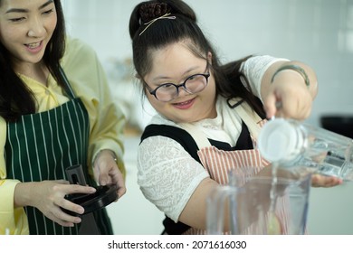 Lifestyle family relationship daughter disability learning in kitchen - Shutterstock ID 2071616030
