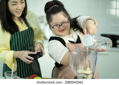 Lifestyle Family Relationship Daughter Disability Learning. Young Girl At Classroom Kitchen Learning