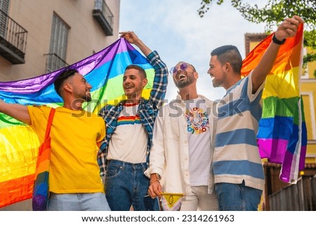Lifestyle of homosexual friends having fun at gay pride party in the city, diversity of young people, demonstration with the rainbow flags, lgbt concept