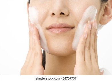 LIFESTYLE IMAGE-close-up Shot Of A Japanese Woman's Face With Soap Bubbles