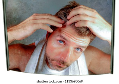 Lifestyle Isolated Portrait Of Attractive Worried And Concerned Caucasian Man Looking At Bathroom Mirror Finding Gray Hair Frustrated In Unhappy Aging Getting Grey Hairs And Body Care Concept