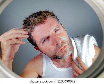 Lifestyle Isolated Portrait Of Attractive Worried And Concerned Caucasian Man Looking At Bathroom Mirror Finding Gray Hair Frustrated In Unhappy Aging Getting Grey Hairs And Body Care Concept