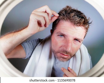 Lifestyle Isolated Portrait Of Attractive Worried And Concerned Caucasian Man Looking At Bathroom Mirror Finding Gray Hair Frustrated In Unhappy Aging Getting Grey Hairs And Body Care Concept