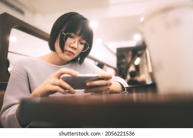 Lifestyle With Modern Technology Concept. Young Adult Lonely Single Woman Holding Smartphone At Public Space. Mental Health Concept.