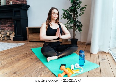 lifestyle moments of a young woman at home. Woman making sport exercises in the living room