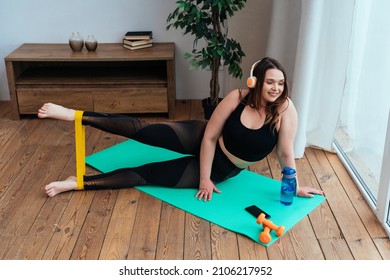 lifestyle moments of a young woman at home. Woman making sport exercises in the living room