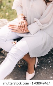 Lifestyle Natural Hands Of Woman With Engagement Ring Wearing Romantic. Micro Wedding Bride Wearing Wedding Pants And Romantic Ruffled Airy Top. Romantic Background Concept. Engagement Proposal. Party