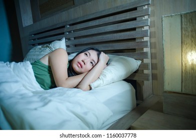 Lifestyle Night Portrait Of Young Beautiful Depressed And Sad Asian Chinese Woman Having Insomnia Lying In Bed Sleepless Suffering Anxiety Stress And Depression Problem Thinking Worried 
