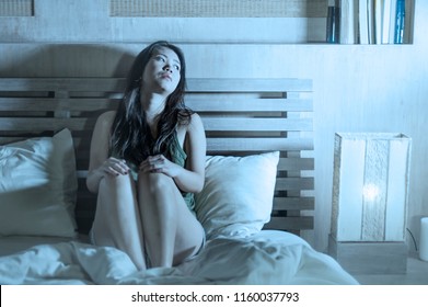 Lifestyle Night Portrait Of Young Beautiful Depressed And Sad Asian Chinese Woman Having Insomnia Sitting In Bed Sleepless Suffering Anxiety Stress And Depression Problem Thinking Worried 