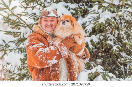 Lifestyle Of Older Man On Retired With A Dog, Senior Man At Winter Snowy Day At Nature, Recreation Concept