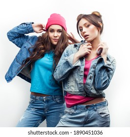 Lifestyle And People Concept: Fashion Portrait Of Two Stylish Sexy Girls Best Friends, Over White Background. Happy Time For Fun