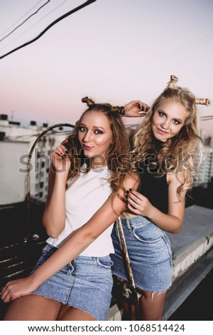 Similar – Image, Stock Photo smiling girls best friends lying on beach while looking camera