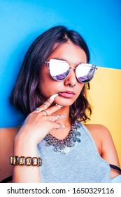 lifestyle people concept. young pretty smiling indian girl with long nails wearing lot of jewelry rings, asian summer happy cool close up