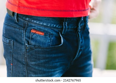 Lifestyle Photo Of A Handsome Man In Denim Jeans Close Up