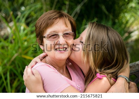 Similar – Woman taking selfie with older mother in wheelchair