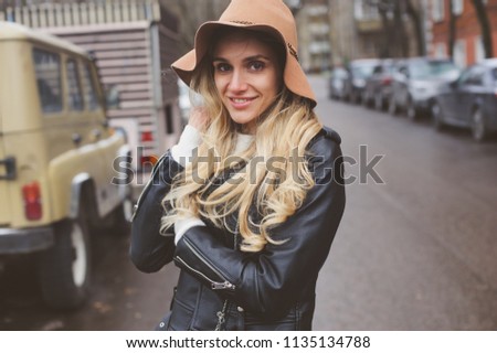 Similar – fashion autumn portrait of young happy woman walking outdoor